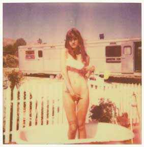 The girl behind the white picket Fence